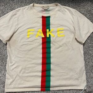 “not fake” Gucci shirt